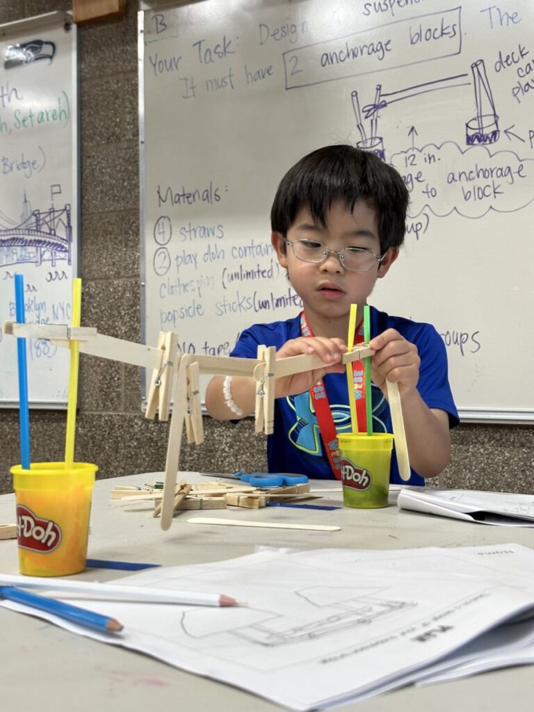 Bellevue Summer Camps Wise Camps camper engaged in an engineering adventure.