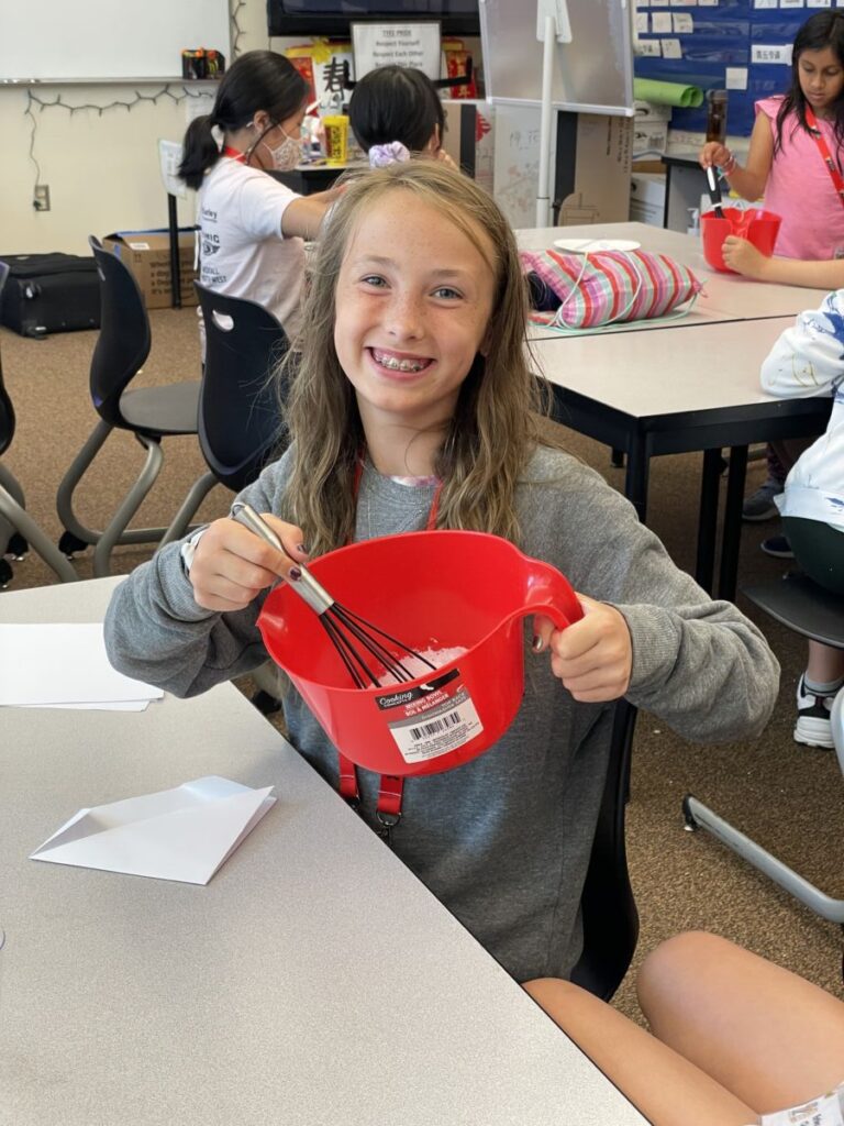 Bellevue Summer Camps Wise Camps camper engaged in a Kitchen Wizards activity.