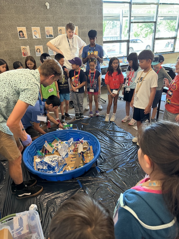 Bellevue Summer Camps Wise Camps campers and staff at the Save Science City station.